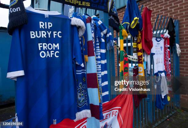 Fans leave scarves, shirts and banners outside the stadium marking the expulsion of Bury FC from the EFL at Gigg Lane on February 13, 2020 in Bury,...