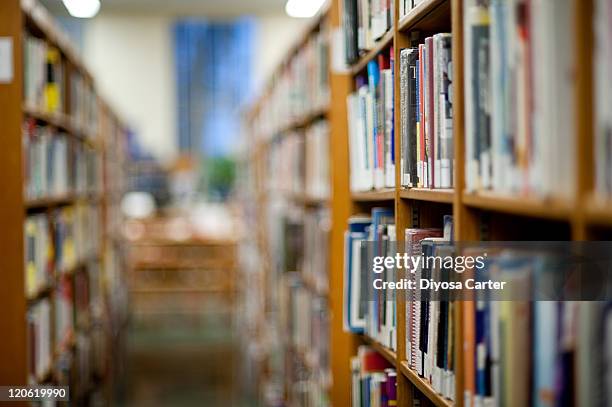 books on shelf in library - 図書室 ストックフォトと画像