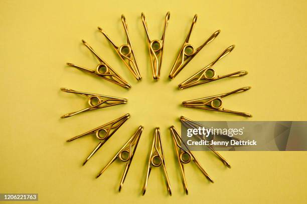 circle of metal pegs - clothes peg stock-fotos und bilder