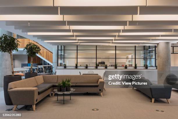 Sitting area next to staff kitchen. YOOX Net-A-Porter Offices, London, United Kingdom. Architect: Grimshaw, 2017.