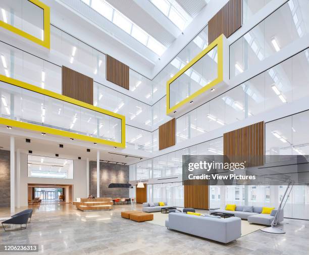 Open plan meeting space and seating area in interior atrium. The Charter Building, Uxbridge, United Kingdom. Architect: dn-a architecture, 2017.