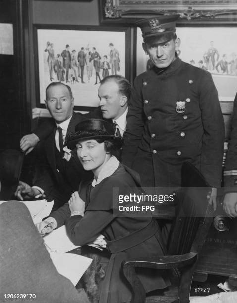 American poet, playwright, novelist and suffragette Mercedes de Acosta checking vote count at a polling station on Madison Avenue at 76th Street, New...