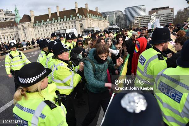 Students scuffle with Police during the "Fridays for Future" climate change rally on Westminster Bridge on February 14, 2020 in London, England. The...