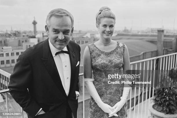 Rainier III, Prince of Monaco and Princess Grace of Monaco, wearing a dress by Givenchy, attend the Bal Petits Lits Blancs at Powerscourt in...