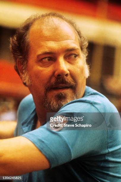 Close-up of American film director Robert Altman as he glances over his shoulder during the filming of his movie 'Brewster McCloud,' San Antonio,...