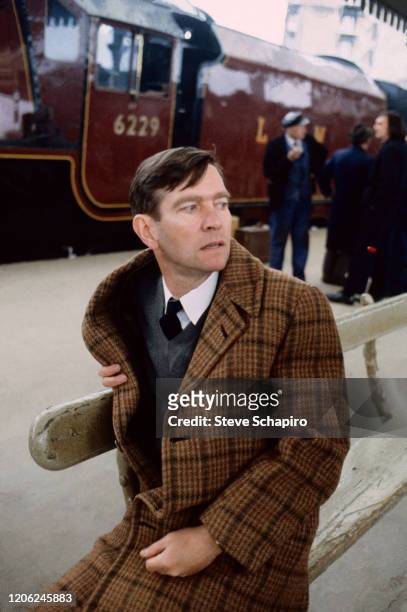 English actor Tom Courtenay sits on a bench during the filming of his movie 'The Movie' , England 1982. Courtenay originated the role in the stage...