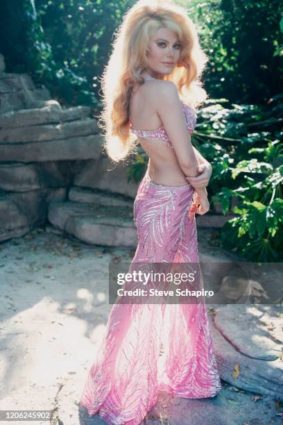 Portrait of Spanish-born American musician and actress Charo as she poses outdoors at her home, Los Angeles, California, 1976.