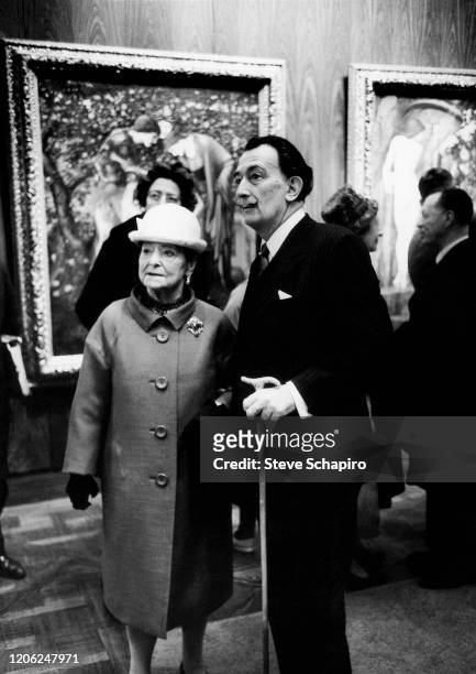 View of Polish-born American businesswomen and art collector Helena Rubinstein and Spanish artist Salvador Dali as they attend an unspecified...