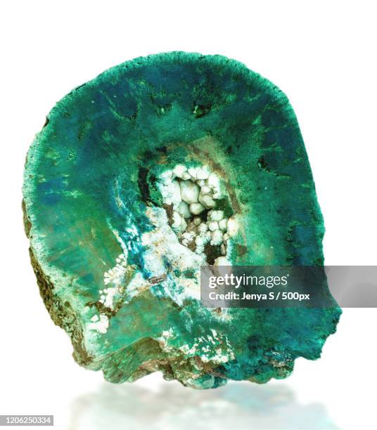 raw emerald stone on white background - emerald gemstone stockfoto's en -beelden
