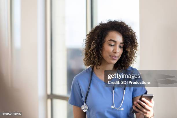 Doctors Ringing Phone Doctor Looking Phone Photos and Premium High Res Pictures - Getty Images