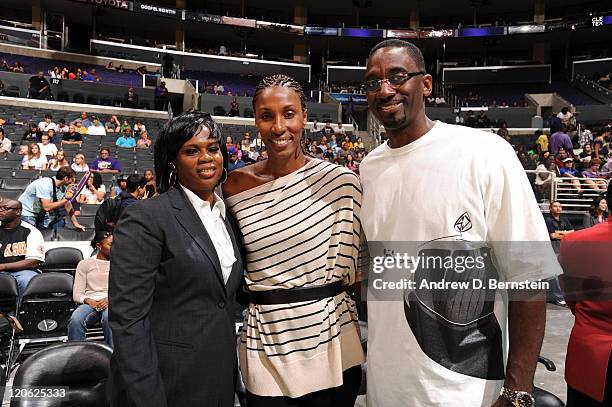 General Manager Penny Toler of the Los Angeles Sparks poses for a photograph with former WNBA player Lisa Leslie and her husband Michael Lockwood...