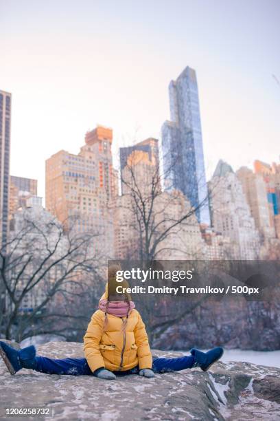 girl doing splits in central park in winter, manhattan, new york city, new york, usa - central park winter ストックフォトと画像