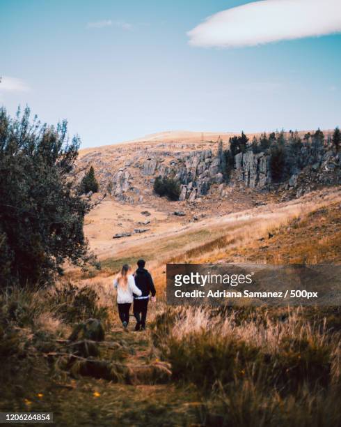 view of couple on walk in mountains, cajamarca, peru - cajamarca ストックフォトと画像