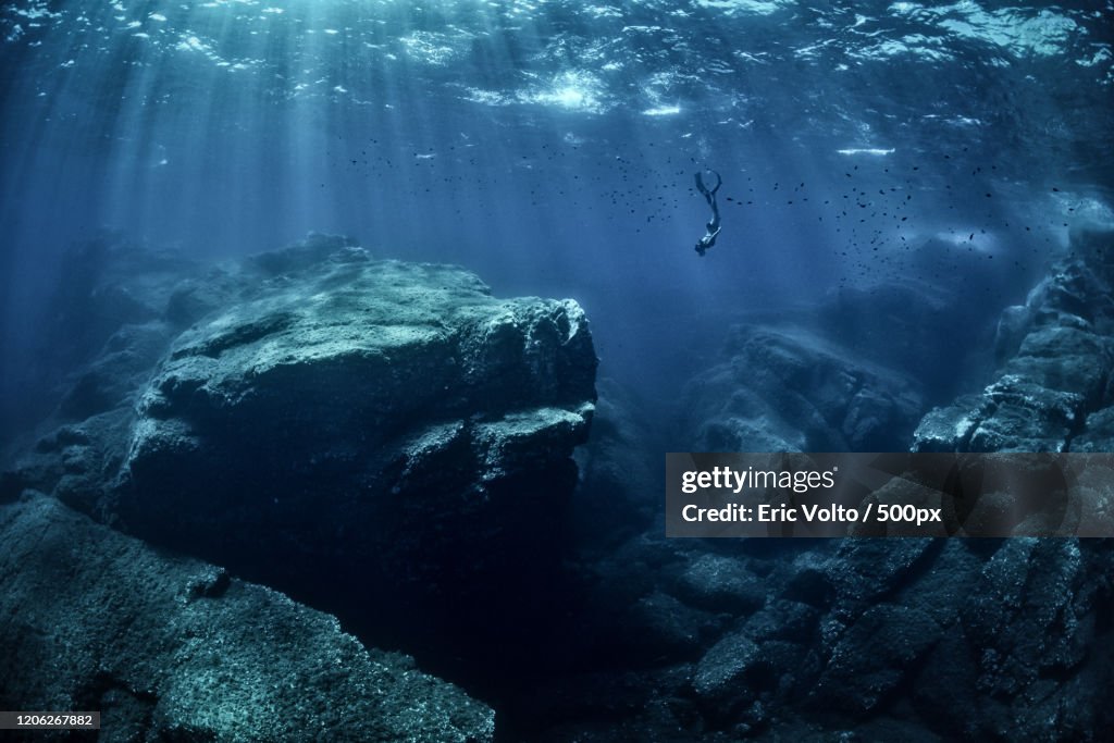 Diving in dark blue sea