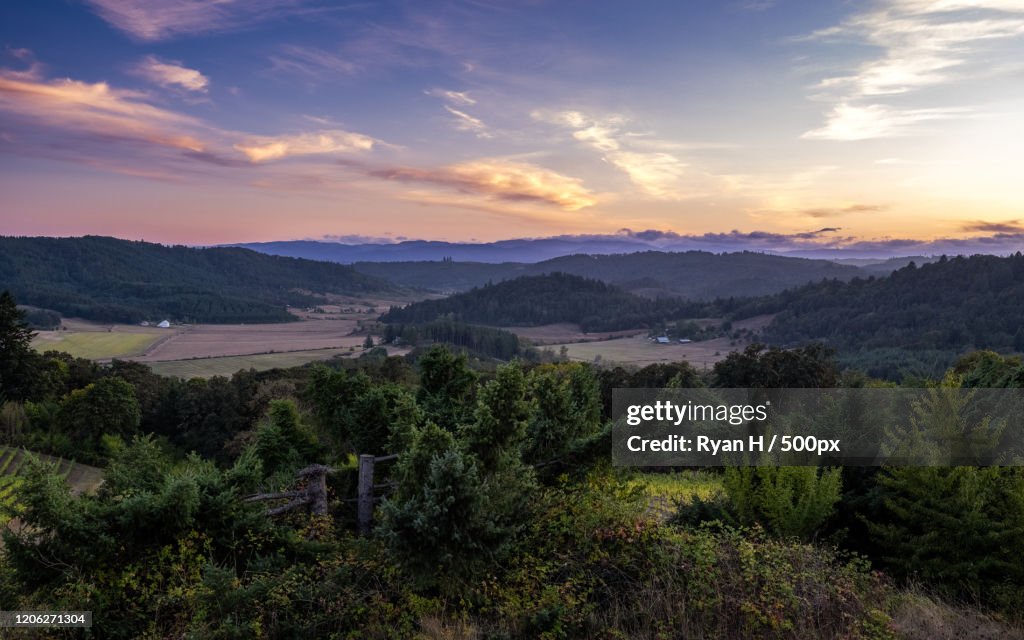View of sunset over valley and hills, Oregon, USA