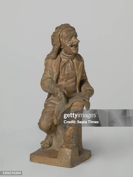 Seated male figure with folded open fold on his knee. He sits on a round elevation with the right foot placed backwards and the left in front of him...