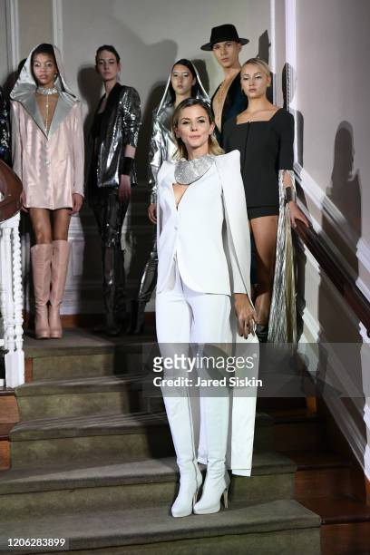 Jime Butti walks the runway with models during the finale at ROSSI TUXEDO, New York Fashion Week, Fall 2020 Collection at Consulate of Argentina on...