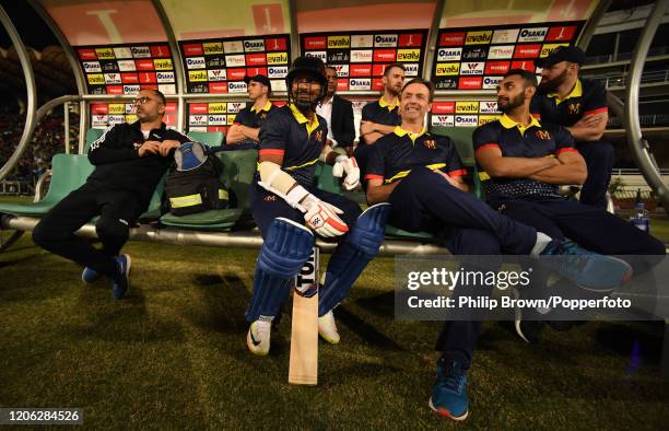 Kumar Sangakkara of the MCC sits with John Stephenson and Ajmal Shahzad waiting for his turn to bat during the T20 match between MCC and Lahore...