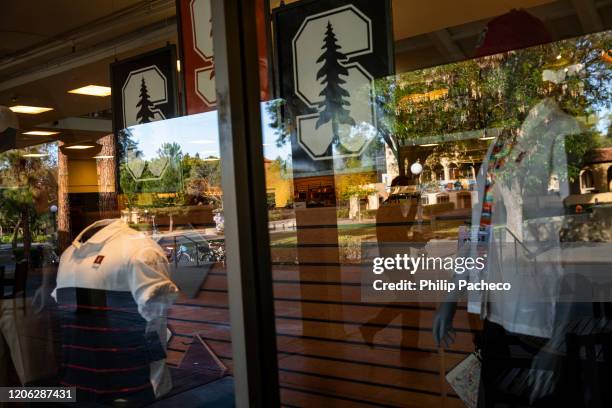 Person walks past the bookstore during a quiet morning at Stanford University on March 9, 2020 in Stanford, California. Stanford University announced...