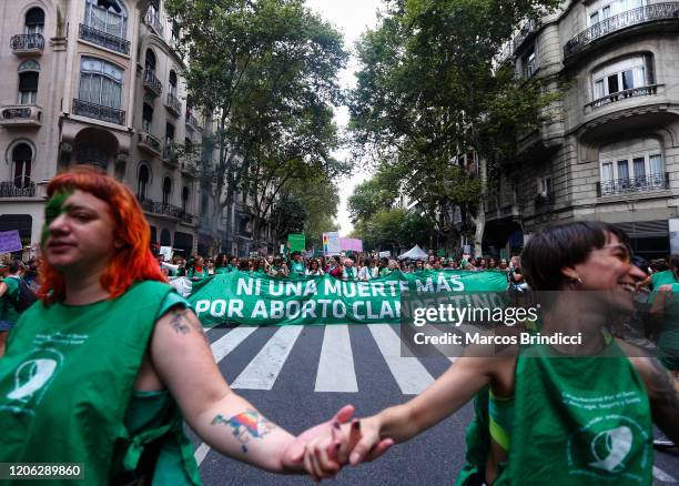 Abortion rights activists hold a banner that reads "No more death for clandestine abortion" during a demonstration as part of national strike after...