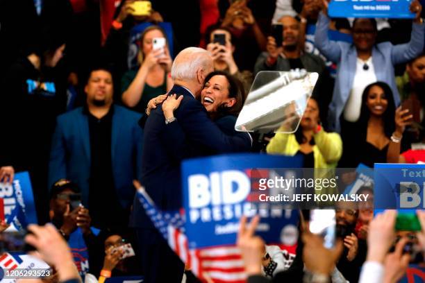 California Senator Kamala Harris hugs Democratic presidential candidate former Vice President Joe Biden after she endorsed him at a campaign rally at...