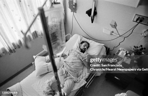 Deotis McMather who has AIDS asleep in bed at SF Generals AIDS ward 5B. After being diagnosed with AIDS, he returned to his SF apartment where all of...