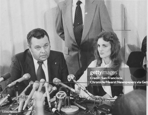 Patricia Hearst who was kidnaped, and participated in crimes of the SLA, and her lawyer Albert Johnson at a press conference after be released on...
