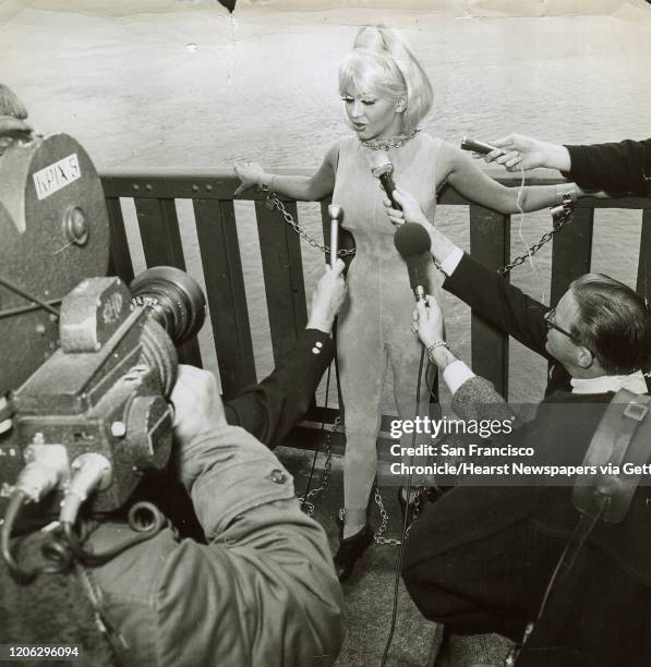 Jpg ;August 6, 1966- North Beach topless star Yvonne D'Angers chains self to Golden Gate Bridge in 1966 to protest her ordered deportation to her...