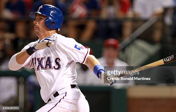 Michael Young of the Texas Rangers hits a single for his 2000th career hit during play against the Cleveland Indians at Rangers Ballpark in Arlington...