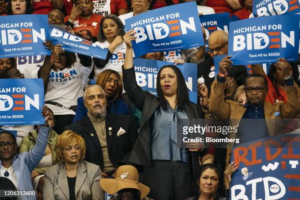 Attendees hold placards during a campaign event with former Vice President Joe Biden, 2020 Democratic presidential candidate, in Detroit, Michigan,...
