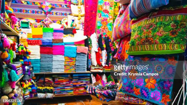 mayan fabrics at in a market at san miguel de allende - mexican textile stock pictures, royalty-free photos & images