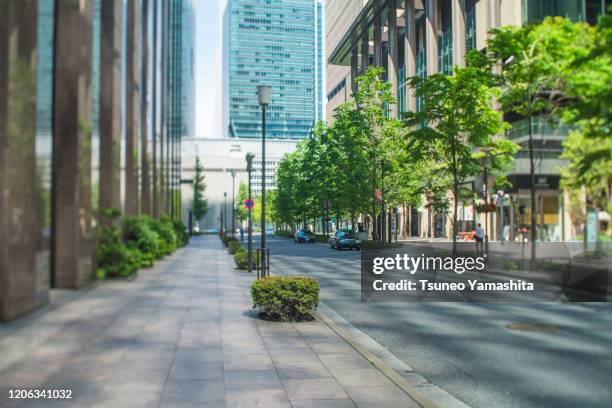 office building area in tokyo marunouchi - downtown district stock-fotos und bilder