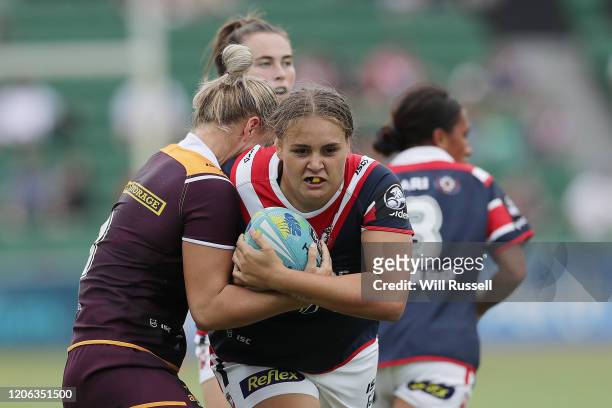 Caitlan Johnston of the Roosters is tackled by Meg Ward of the Broncos during Day 2 of the 2020 NRL Nines at HBF Stadium on February 15, 2020 in...
