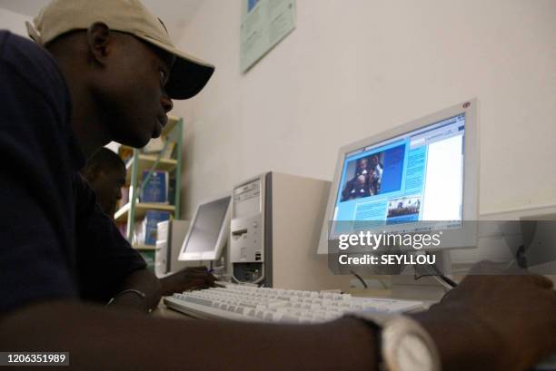 Student consults his computer 22 November 2004 at the Dakar Francophone Digital Campus . The CNFD is an educational facility established in 2000 by...