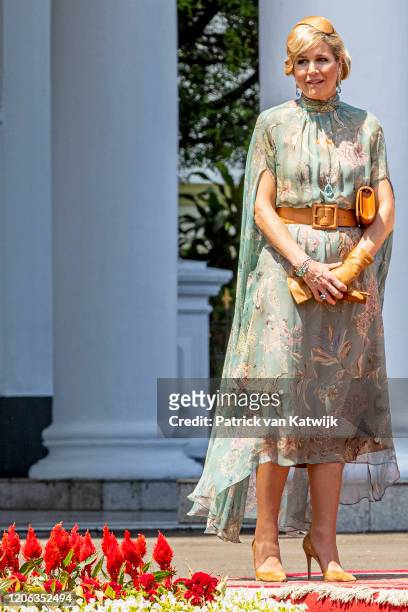 Queen Maxima of The Netherlands is welcomed by President Jcand his wife Iriana Widodo with an official welcome ceremony at the Presidential Palace on...