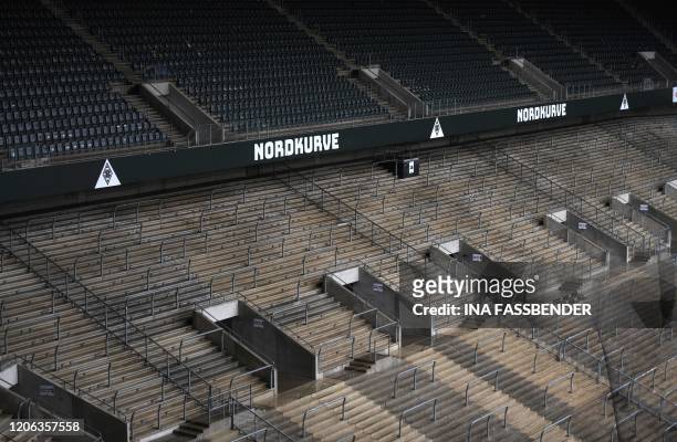 Empty seats and stands at Borussia-Park football stadium are pictured on March 10, 2020 in Mönchengladbach. - Rhine Bundesliga derby between Borussia...