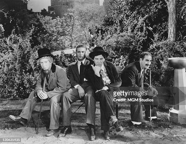 Harpo Marx , Allan Jones , Chico Marx and Groucho Marx in a scene from 'A Night At The Opera', directed by Sam Wood, 1935.