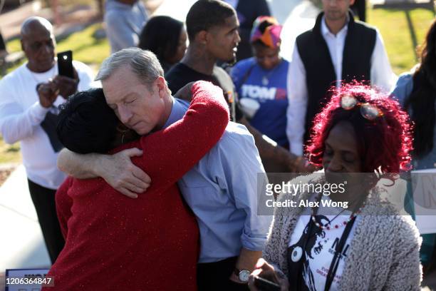 Democratic presidential candidate Tom Steyer hugs a supporter during a campaign event at Martin Luther King Jr. Senior Center February 14, 2020 in...