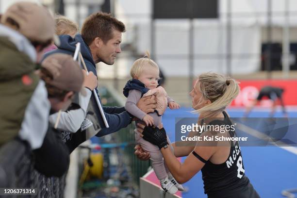 Former All Blacks captain Richie McCaw with daughter Charlotte and wife Gemma McCaw of New Zealand following the FIH Pro League match between New...