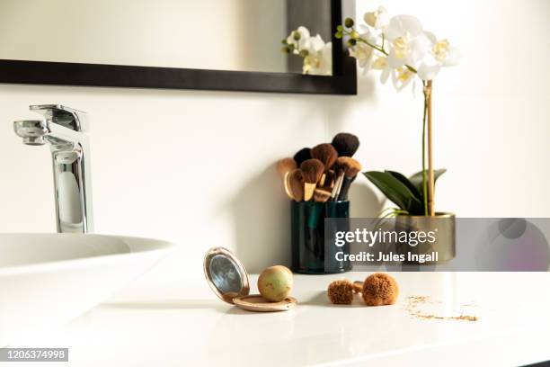 bunch of makeup brushes on a bench - green belt fashion item stock pictures, royalty-free photos & images