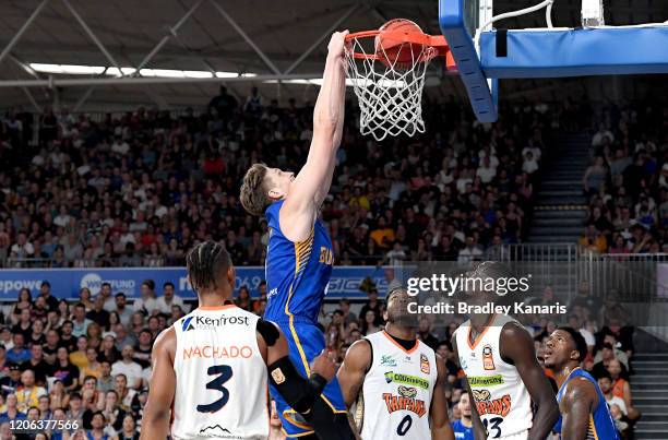 Matthew Hodgson of the Bullets slam dunks during the round 20 NBL match between the Brisbane Bullets and the Cairns Taipans at Nissan Arena on...