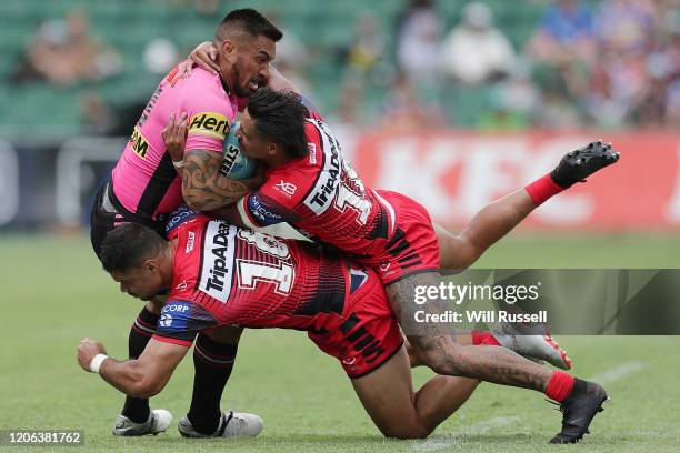 Dean Whare of the Panthers is tackled by Brayden Wiliame and Jayden Sullivan of the Dragons during Day 2 of the 2020 NRL Nines at HBF Stadium on...