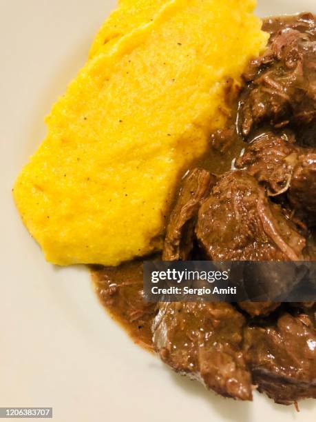 italian stracotto with polenta - pot roast stock pictures, royalty-free photos & images