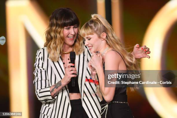 Angele Van Laeken aka Angele celebrates after receiving the best live show award next to Daphne Burki during the 35th 'Les Victoires De La Musique'...