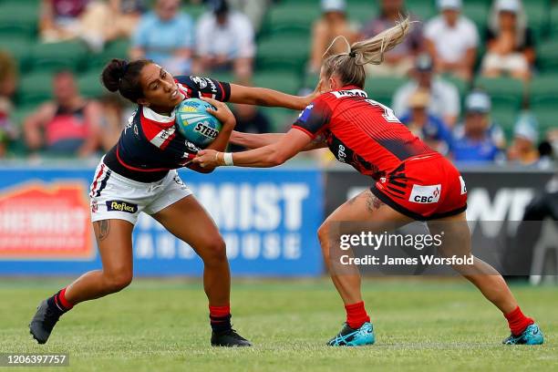 Maddison Studdon of the Dragons tackles down Ash Quinlan of the Roosters during the match between the Dragons and Roosters from Day 2 of the 2020 NRL...