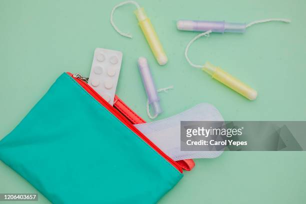 sanitary  bag and sanitary pad background in turqoise colorful background - sports period stock pictures, royalty-free photos & images