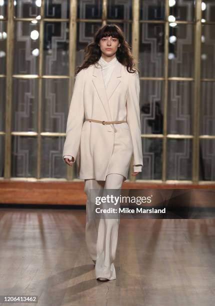 Model walks the runway at the Petar Petrov show during London Fashion Week February 2020 at the Royal Institute of British Architects on February 15,...