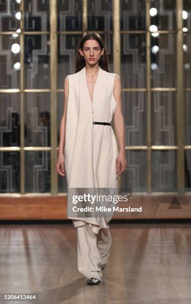 Model walks the runway at the Petar Petrov show during London Fashion Week February 2020 at the Royal Institute of British Architects on February 15,...