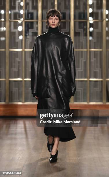 Model walks the runway at the Petar Petrov show during London Fashion Week February 2020 at the Royal Institute of British Architects on February 15,...