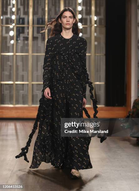 Model walks the runway at the Petar Petrov show during London Fashion Week February 2020 at the Royal Institute of British Architects on February 15,...